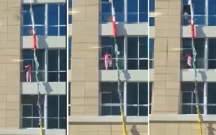 فيديو...خادمة تستخدم الأغطية للهروب من الطابق الثامن في أبوظبي