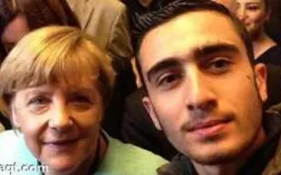 سيلفي مع ميركل يقلب حياة لاجئ سوري