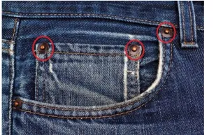 ما سبب وجود أزرار صغيرة على جيوب بنطال الجينز؟