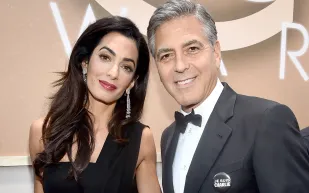 جورج وأمل كلوني يساعدان 3 آلاف طفل لاجئ سوري.. هذا ما قدماه