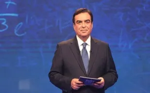 كيف أصبح جورج قرداحي صاحب "من سيربح المليون" وزيرًا للإعلام؟