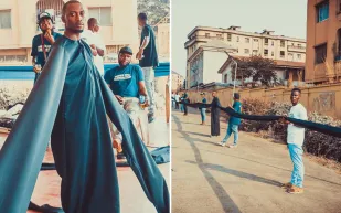 مصمم أزياء  يدخل موسوعة غينيس بأطول أكمام في العالم (صور)