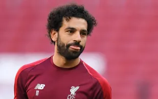 نقاش محتدم حول أداء محمد صلاح.. نيفيل ينتقد وسلوت يرد بقوة