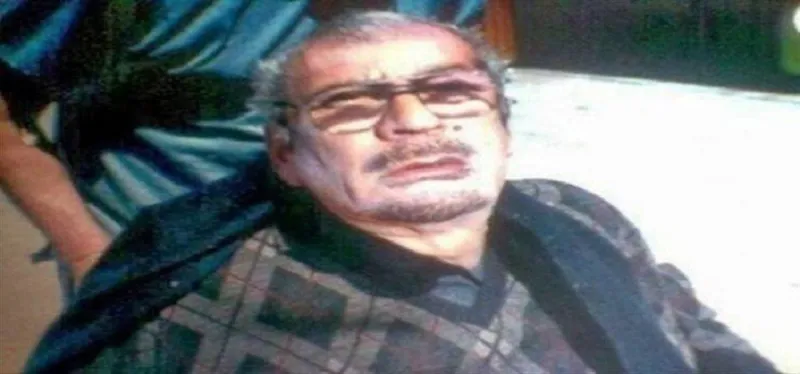 بالصور : القذافي حي يرزق والقتيل شبيهه ؟!