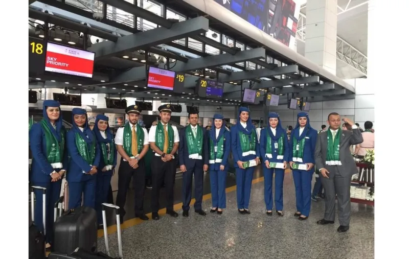 احتفال لمسافري الخطوط السعودية في مطار قوانجو الصيني بمناسبة اليوم الوطني