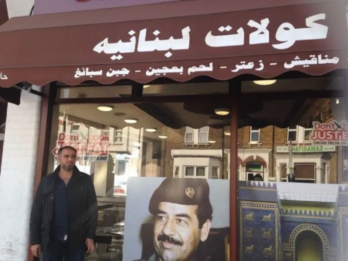 بالصور: مطعم في لندن يرفض ازالة صور لصدام حسين عن واجهته